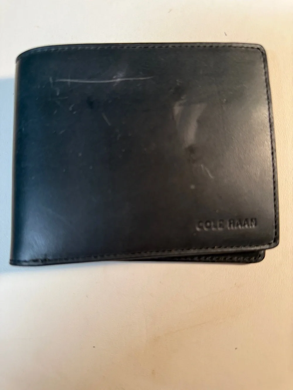 Cole Haan Black Leather Folded Wallet with Embossed Logo